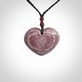 A hand carved heart pendant made from New Zealand Aroha Stone. This is a smaller sized and visually striking piece, beautifully curved and sensuous. The perfect piece of jewellery for someone you love.
