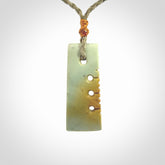This is a lovely small notched toki pendant made from a gorgeous New Zealand Flower Jade.