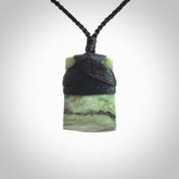 Hand carved from a lovely piece of local New Zealand Jade. The quality of the workmanship and design is outstanding - this is a piece you will want to wear all the time. We have suspended this from a 4-plait black cord which can be adjusted with a couple of slip knots and black binding.