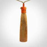 A Striking Whale Bone Toki Pendant
