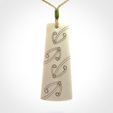 Hand carved bone toki pendant