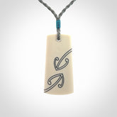 Hand carved bone toki pendant