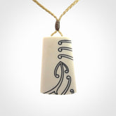 Hand carved bone toki pendant