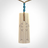 Hand carved bone toki pendant