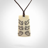 Hand carved bone toki pendant