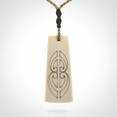 Hand carved bone toki pendant