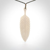 A hand carved large bone fern leaf necklace. A beautiful large fern leaf pendant carved from bone for NZ Pacific. This is a true piece of wearable art and is provided with an adjustable cord.