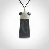 A gorgeous black jade toki pendant, carved with New Zealand's silver fern in relief. This is a pendant we designed for the Rugby World Cup. It is the fern that our national team the All Blacks wear on their jerseys, and the black is the colour of their team uniform. A fantastic and visually striking pendant, designed and carved by NZ Pacific.