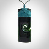 Hand made large New Zealand Tangiwai toki pendant. Hand carved in New Zealand by Graeme Wylie for NZ Pacific . Hand made jewellery. Unique large Jade Toki with adjustable length cord. Free shipping worldwide.