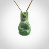 Hand carved boxing glove made from Jade. The cord is adjustable so that you can wear this where it suits you best. The cost of shipping worldwide is included in the price.