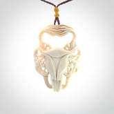 This is a hand carved contemporary bison bone skull pendant. This is a medium sized necklace and is a very unique, one only, pendant that is a piece for bison lovers.