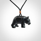 This picture shows a pendant that we designed in black jade. It is a little black bear that has a walking stance and is carved in detail. A really attractive and eye-catching piece of handmade jewellery. The cord is black and the length can be adjusted.