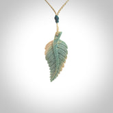 Hand carved blue Mammoth Tusk feather pendant with hand plaited adjustable cord. Woolly Mammoth tusk feather necklace. Hand carved by NZ Pacific. Art to Wear.