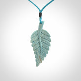 Hand carved blue Mammoth Tusk feather pendant with adjustable cord. Woolly Mammoth tusk feather necklace. Hand carved by NZ Pacific. Art to Wear.