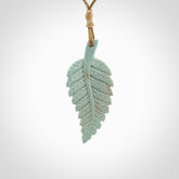 Hand carved blue Mammoth Tusk feather pendant with adjustable cord. Woolly Mammoth tusk feather necklace. Hand carved by NZ Pacific. Art to Wear.