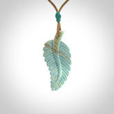 Hand carved blue Mammoth Tusk feather pendant with adjustable cord. Woolly Mammoth tusk feather necklace. Hand carved by NZ Pacific. Art to Wear.