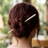 Woman wearing a bone hair pin
