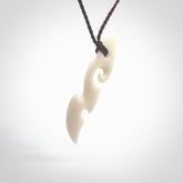 This is a wonderful, contemporary large koru from bone. Hand carved and provided with an adjustable brown cord. Order yours now on NZ Pacific at www.nzpacific.com