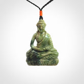 This photo shows a Buddha pendant hand carved in Jade. It is provided with an adjustable cord.