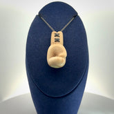 Hand carved boxing glove made from deer antler. The cord is adjustable so that you can wear this where it suits you best.
