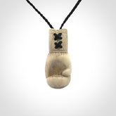 Hand carved boxing glove made from deer antler. The cord is adjustable so that you can wear this where it suits you best.