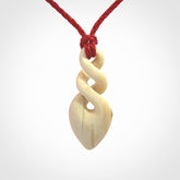 Hand carved woolly mammoth tusk twist pendant. Made by NZ Pacific.
