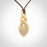 Elegant and striking twist pendants carved from mammoth tusk that's over 30,000 years old - a beautiful and ancient material.