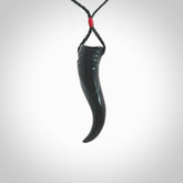 Black jade Italian Horn pendant. Handmade jade jewellery made by NZ Pacific and for sale online. Black Jade Goat Horn pendant worn for protection over evil eye, bad luck and promotes fertility. Ancient symbolic necklace hand made in Australian Black Jade.