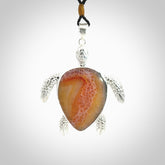 Snakeskin Agate stone turtle in Sterling silver engraved casing. Hand carved jewellery made by NZ Pacific and for sale online.