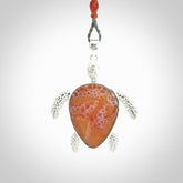 Snakeskin Agate stone turtle in Sterling silver engraved casing. Hand carved jewellery made by NZ Pacific and for sale online.