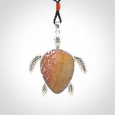 Snakeskin Agate stone turtle in Sterling silver engraved casing. Hand carved jewellery made by NZ Pacific and for sale online.
