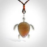 Snakeskin Agate stone turtle in Sterling silver engraved casing. Hand carved jewellery made by NZ Pacific and for sale online.