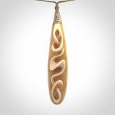 A handcarved masterpiece. A complex twist pendant carved from bone by Yuri Terenyi for NZ Pacific. This is a true piece of wearable art which is collectible. A one-off masterpiece and quite unique. Delivered with Express Courier and gift wrapped in a woven kete pouch.