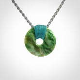 A Unique and Bold Disc Pendant with an Open Heart