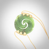 Two Jade koru partner pendants. Necklace hand carved in New Zealand jade, pounamu by NZ Pacific. These are partner pendants that represent partnerships. The jade is a beautiful bright green and we have suspended these on adjustable cords so that you can position the pendant where it suits you best. Postage is included in the price and we ship worldwide.
