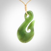 Hand carved New Zealand Jade hook pendant.