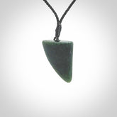 This is a lovely New Zealand Jade, pounamu drop pendant. It is bound with an adjustable Black coloured cord which is length adjustable.