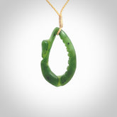 Hand carved contemporary jade broken sea shell jewellery. Made by Donna Summers for NZ Pacific from New Zealand greenstone. Authentic jade jewellery for sale online. These are a beautiful and feminine necklace and would make the perfect gift for the women in your life.