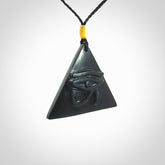 An Egyptian Eye of Ra pyramid pendant, hand made for us from Australian Black Jade. This pendant is provided with an adjustable black cord.