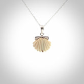 Hand made woolly mammoth tusk fanshell necklace with Sterling Silver. Mammoth tusk fanshell pendant with Sterling silver surround and chain. Made by NZ Pacific and sale online only.