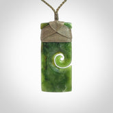 New Zealand jade toki koru pendant. Hand carved in New Zealand. Hand made jewellery. Provided with an adjustable cord.
