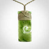 New Zealand jade toki koru pendant. Hand carved in New Zealand. Hand made jewellery. Provided with an adjustable cord.