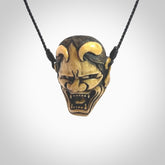 Hand carved Hannya mask Pendant. Made from Red Deer antler in New Zealand. Unique Hannya Play Mask necklace hand made from deer antler by master bone carver Fumio Noguchi. Spectacular collectable work of art, made to wear. One only pendant, delivered to you with express courier.