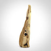 Hand carved incredible nine-tailed fox bone carving. A stunning work of art, beautifully replicating a nine-tailed fox. A one off collectors item that has been hand crafted to be worn or displayed.