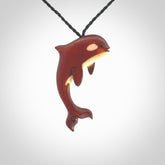 Stained Bone and natural bone orca. Hand carved pendant made by NZ Pacific. Hand carved Bone orca necklace hand made by Yuri Terenyi.