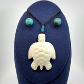 Hand carved white onyx turtle pendant. Unique handmade jewellery for sale online.