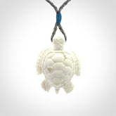 Hand carved white onyx turtle pendant. Unique handmade jewellery for sale online.