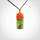 Unique small Jade Toki hand carved here in New Zealand, the cord is adjustable.