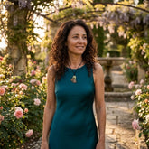 Woman wearing bronze and jade ginkgo leaf pendant