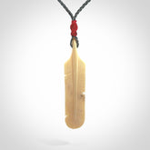 Hand carved Woolly Mammoth Tusk feather pendant. Art to Wear. Provided with adjustable cord.
